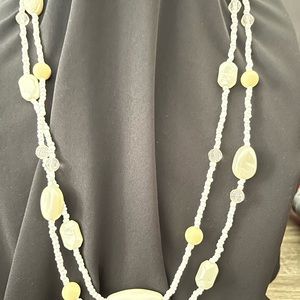 Ivory color vintage costume necklace with plastic beads.